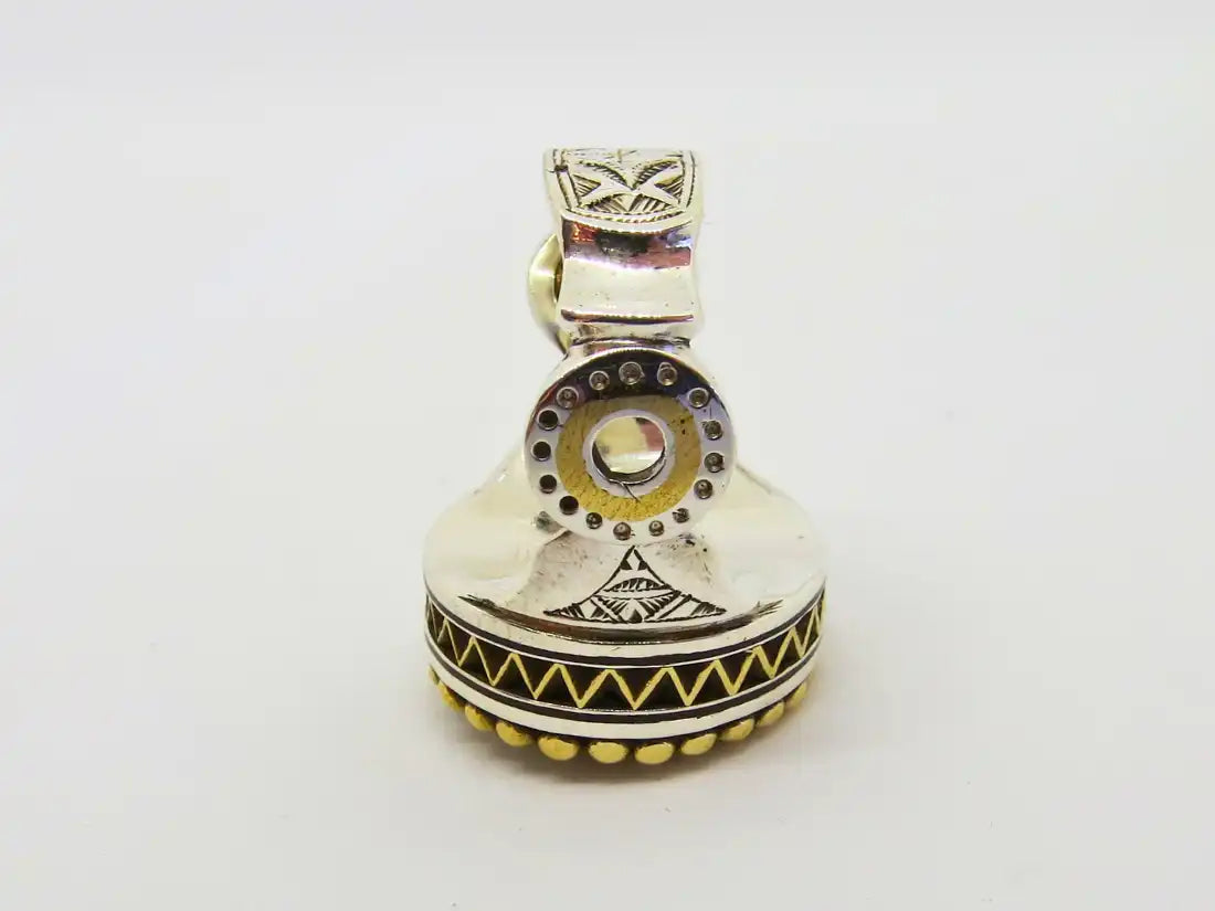 Legacy of Protection: Tuareg Berber Oval Ring with Tribal Engravings and Chevron Bead