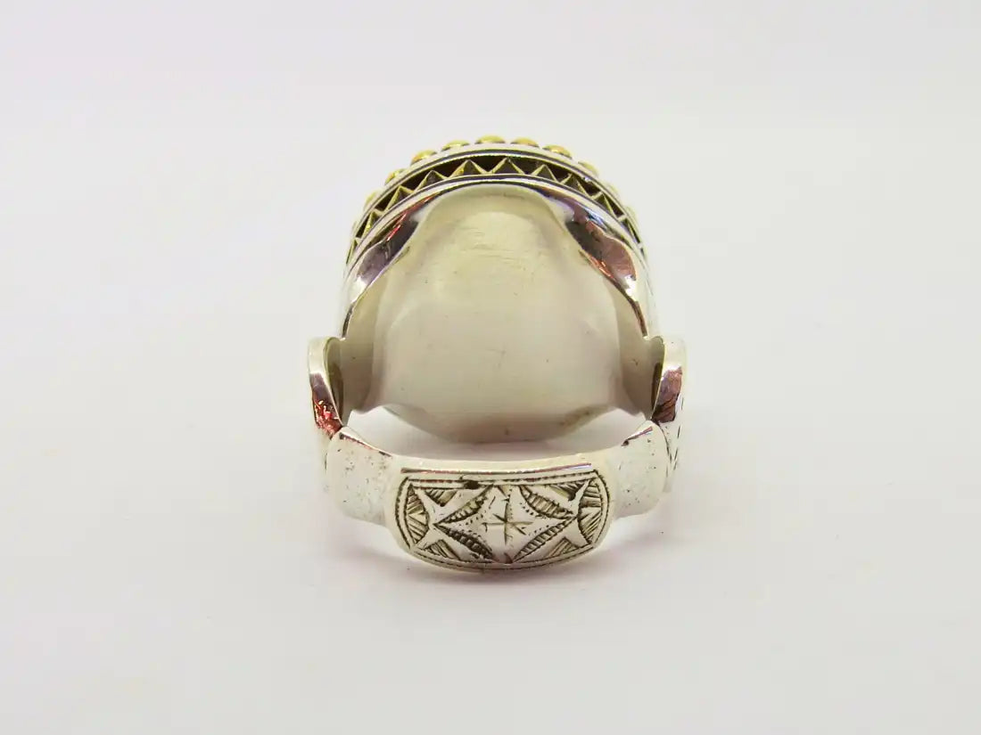 Legacy of Protection: Tuareg Berber Oval Ring with Tribal Engravings and Chevron Bead